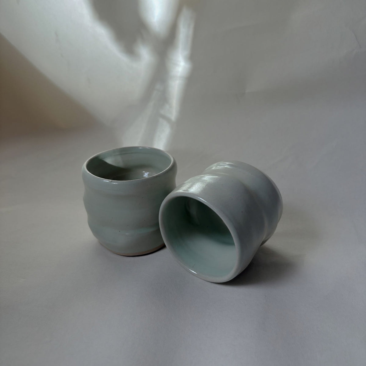 Twisted satin green ceramic coffee cup