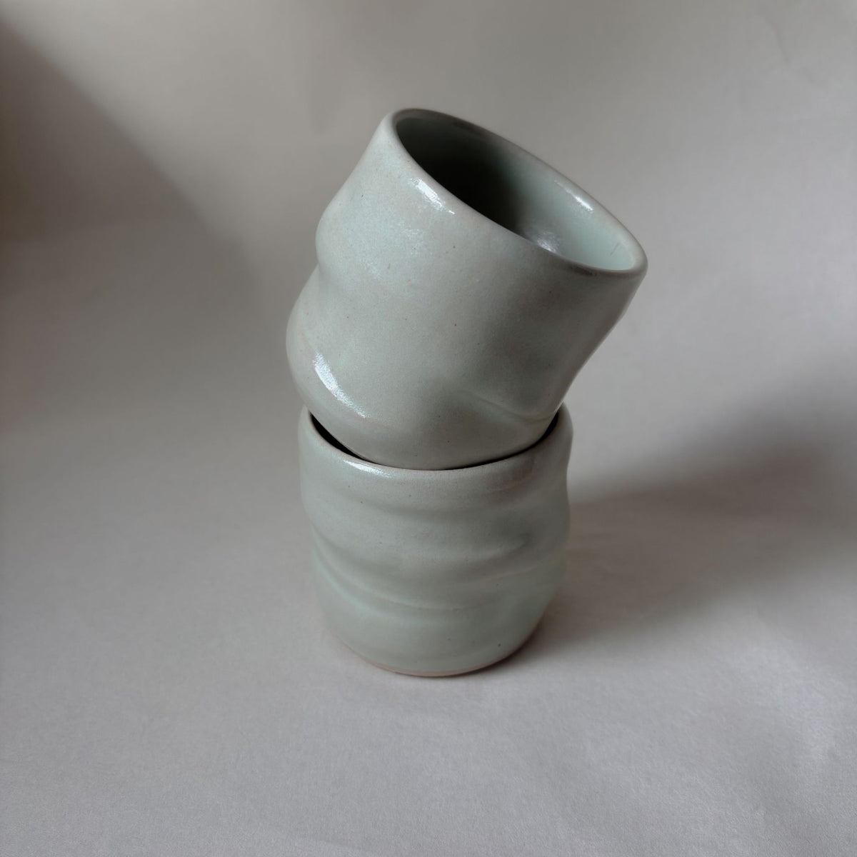 Twisted satin green ceramic coffee cup